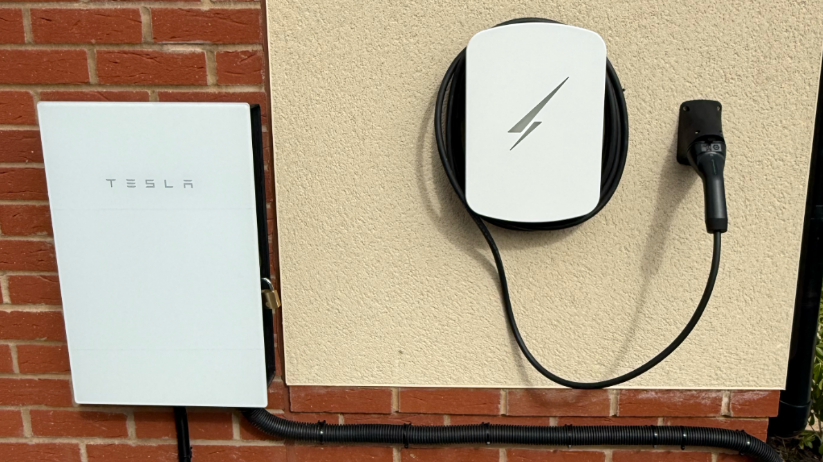 Tesla energy gateway and white Hypervolt charger installed at our home